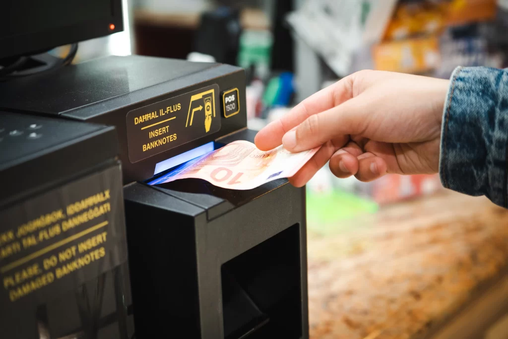 Cashlogy automated cash handling system installed at a checkout